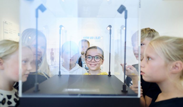 Children look into showcases